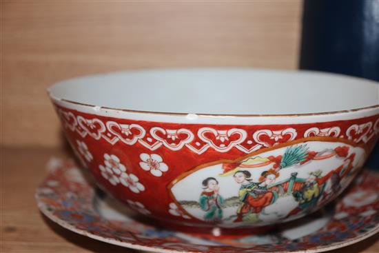 A Chinese porcelain bowl, decorated with figures in reserves on an iron red ground and two other items,